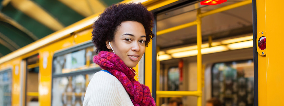 Young woman using public transport - Business Intelligence for Public Transport