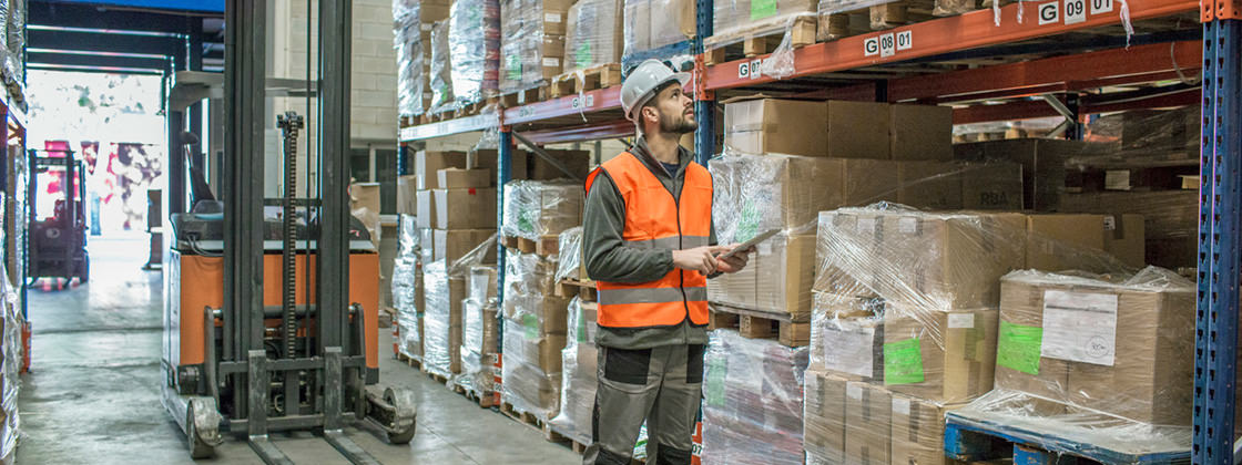 Warehouseman working with tablet in warehouse - Mobile Solution for Microsoft Dynamics NAV