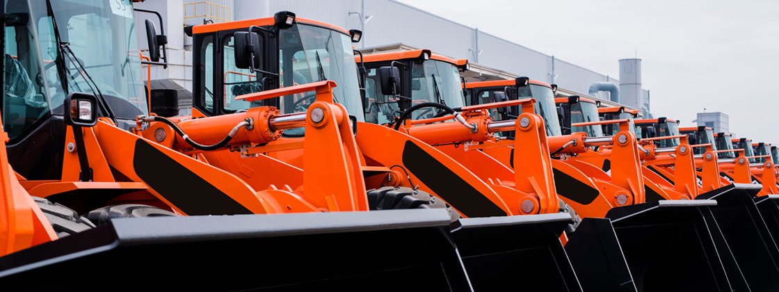 Row of tractors for renting - ERP software for Rental Services
