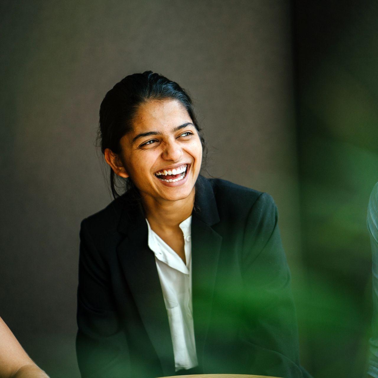 female coworkers laughing